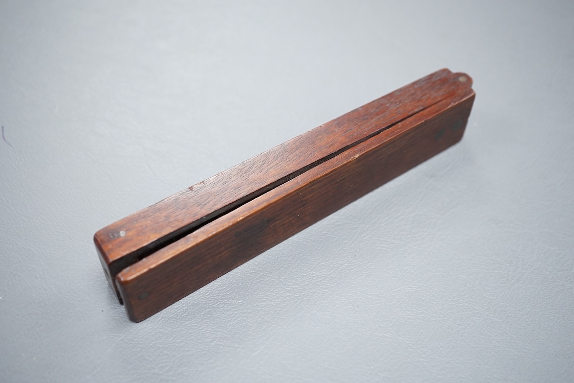 A set of 19th century brass and mahogany folding sovereign scales, 14cm long.